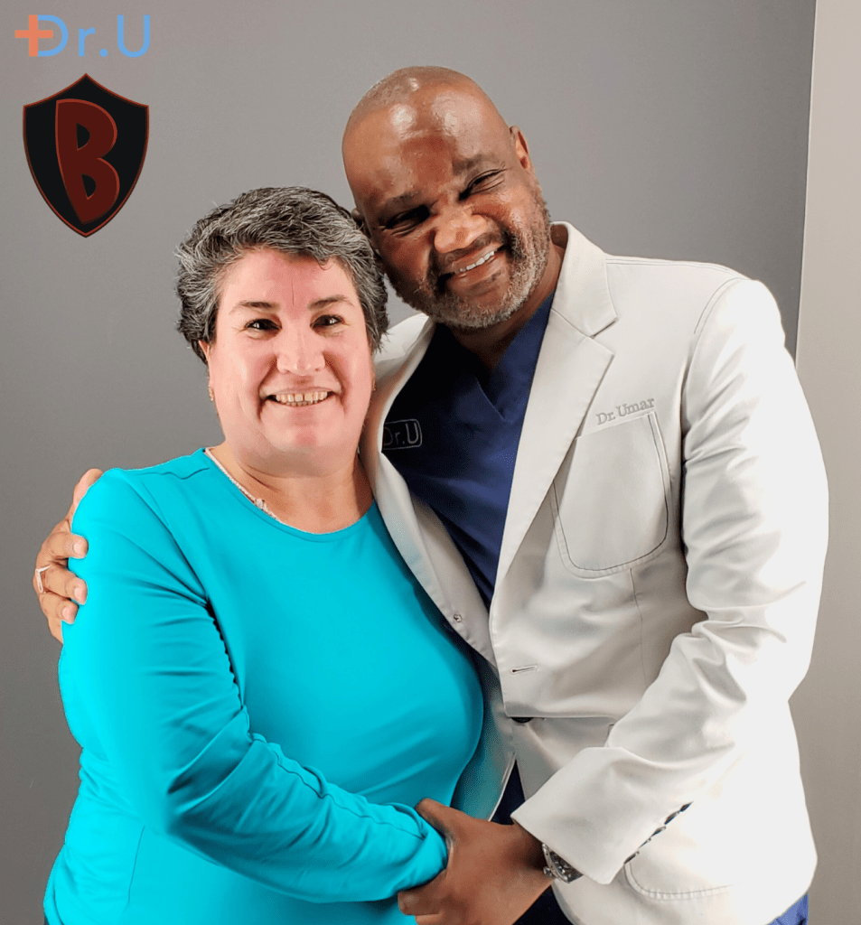 Maria, pictured with Dr. Umar. She’s grateful to live AKN-free now. 